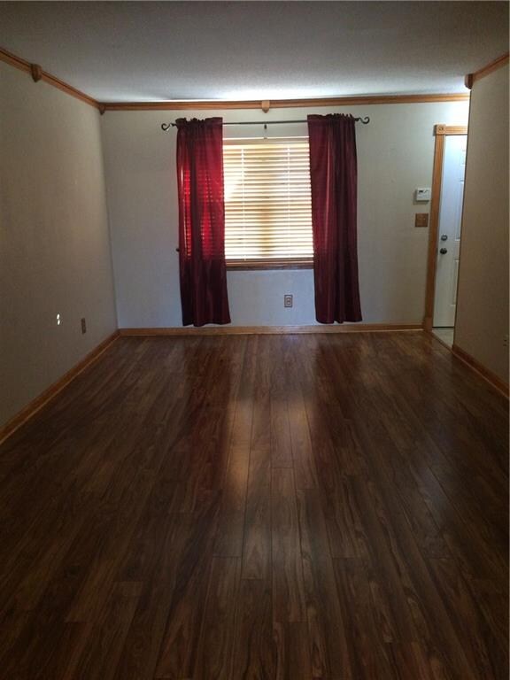 Nice sized living room has beautiful laminate floo
