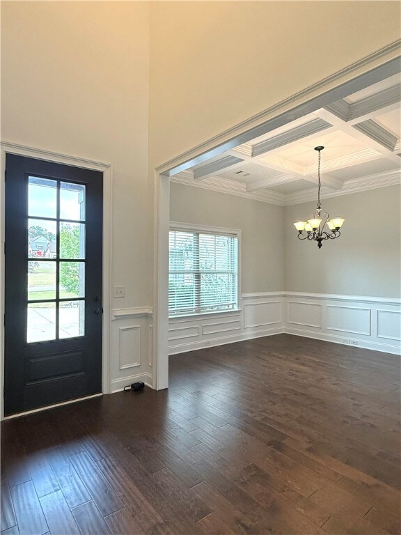 The foyer and formal dining room features paneling