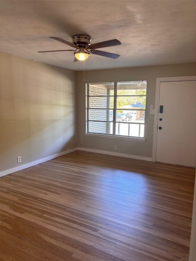 Entryway featuring wood finished floors and a ceiling fan