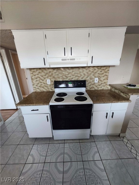Kitchen featuring range with electric stovetop, un