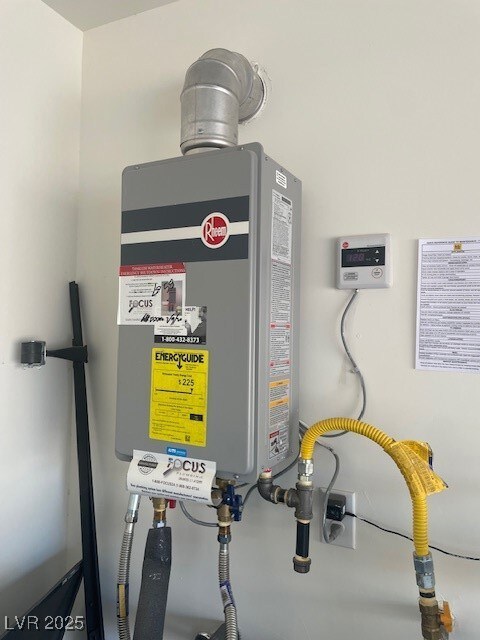 Utility room featuring water heater