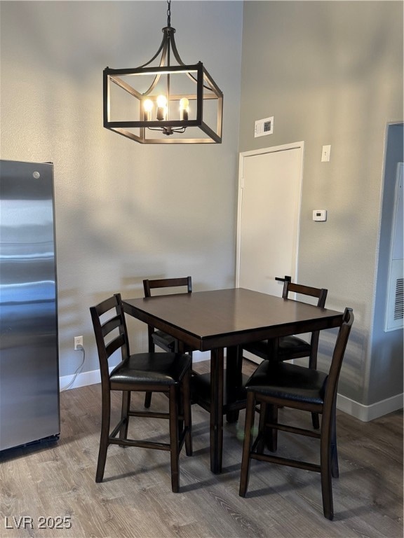 Dining room featuring a high ceiling, an inviting