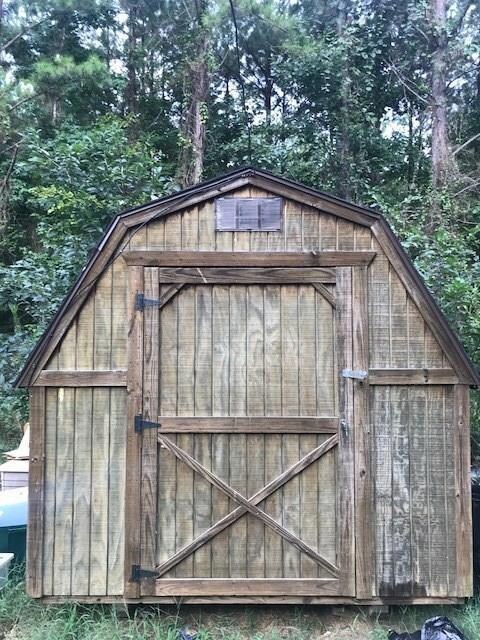 Shed to remain with electricity ran to it.