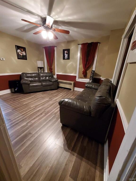 Living room with fresh paint and new flooring.