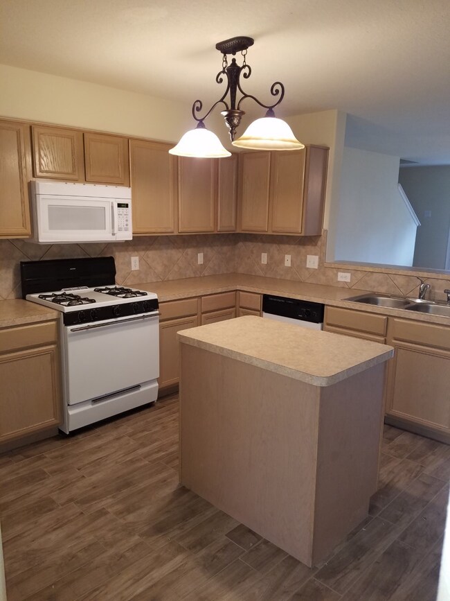 Kitchen updated with stainless steel appliances (no longer white). Gas stove. Fridge included.