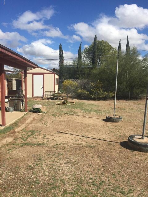 Long shot of yard  and shed