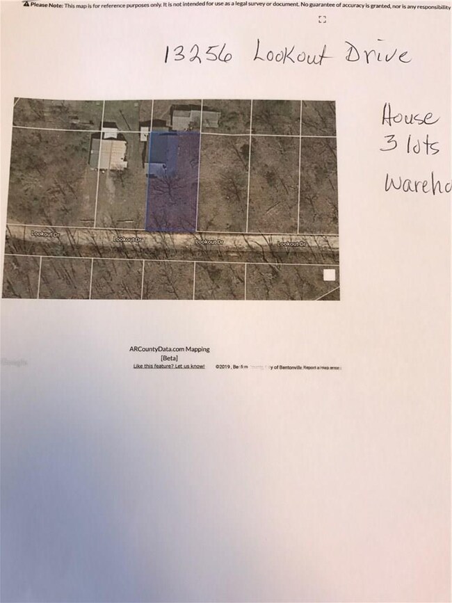 Aerial photo of house and one lot.