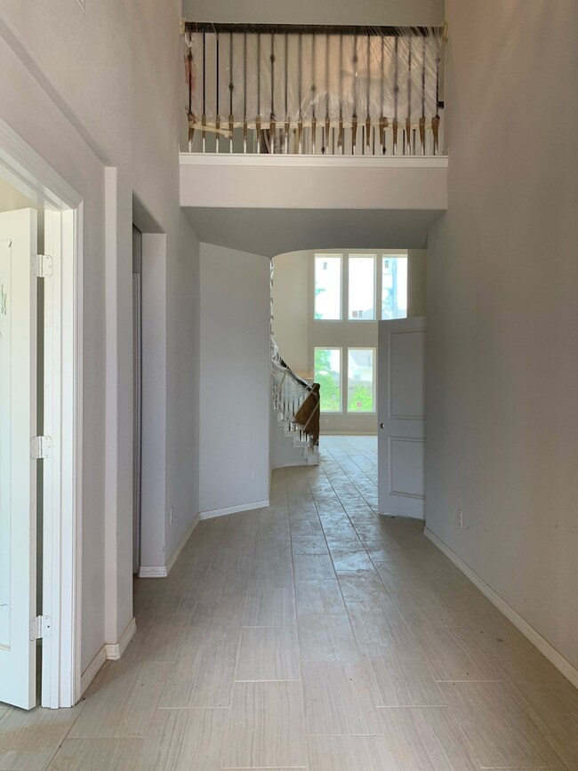 Enter into over 19' soaring ceilings.