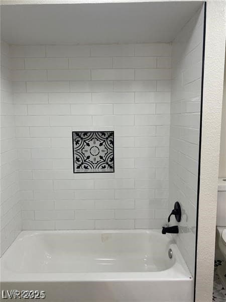 Full bathroom featuring toilet and bathtub / shower combination