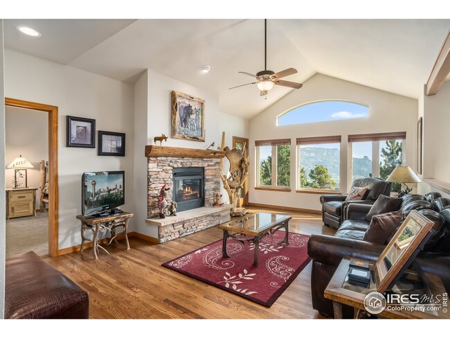 Living Room with cathedral ceilings and fireplace
