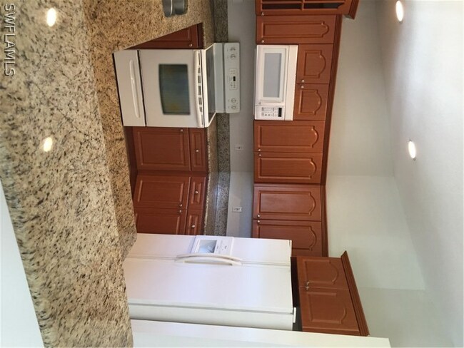 Lots of cabinets and granite counter tops