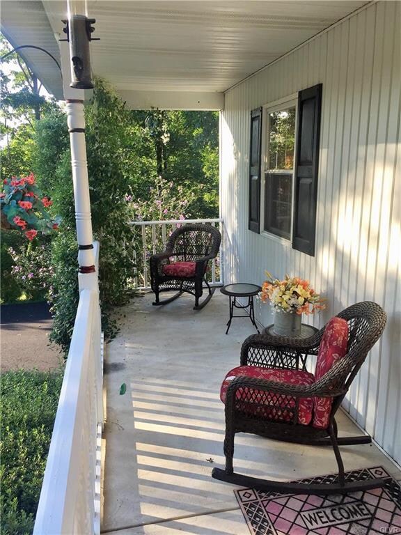 Lovely front porch perfect for watching sunsets.
