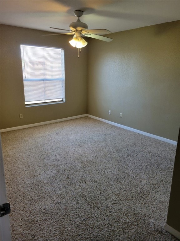 Unfurnished room with a ceiling fan and carpet flo