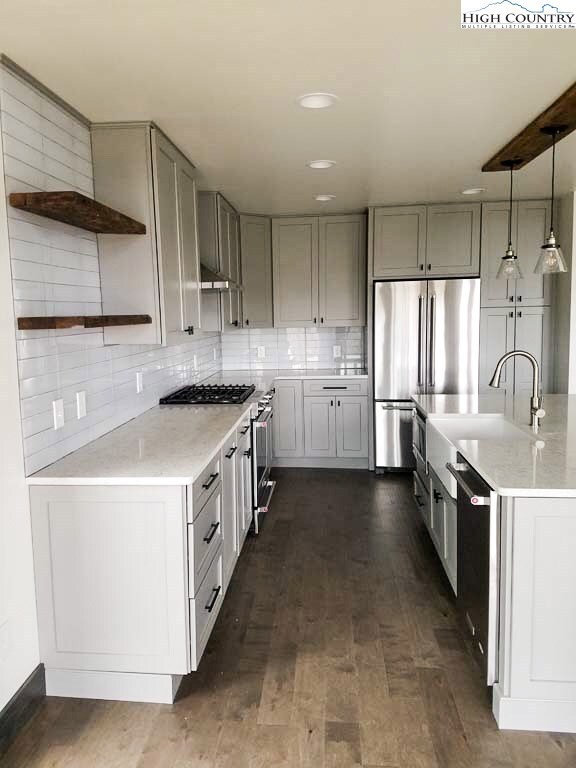Newly finished kitchen has plenty of storage and g