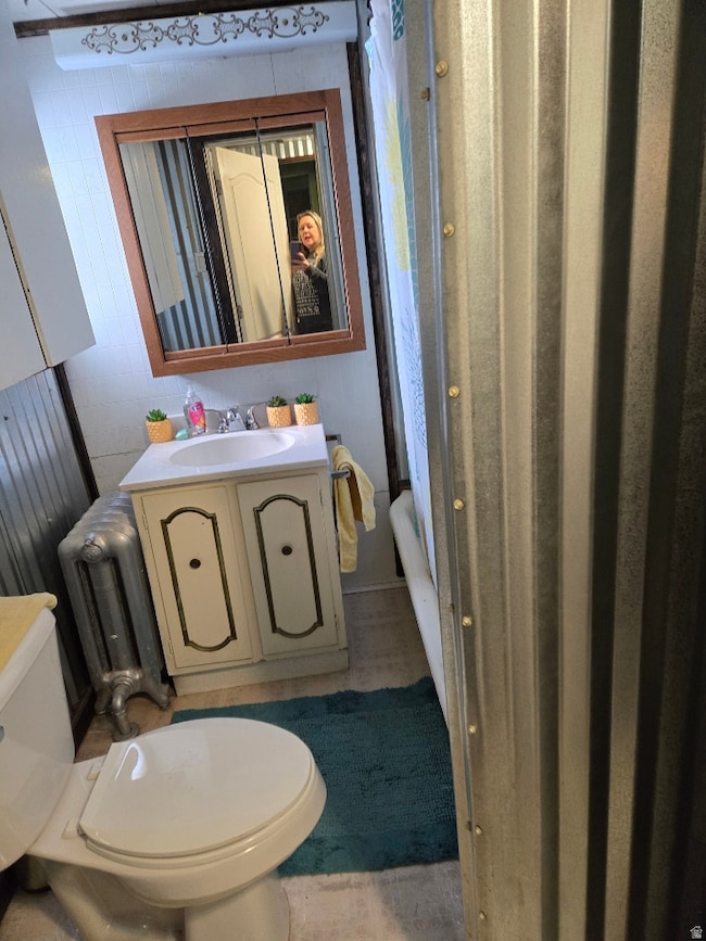 Bathroom featuring vanity and radiator