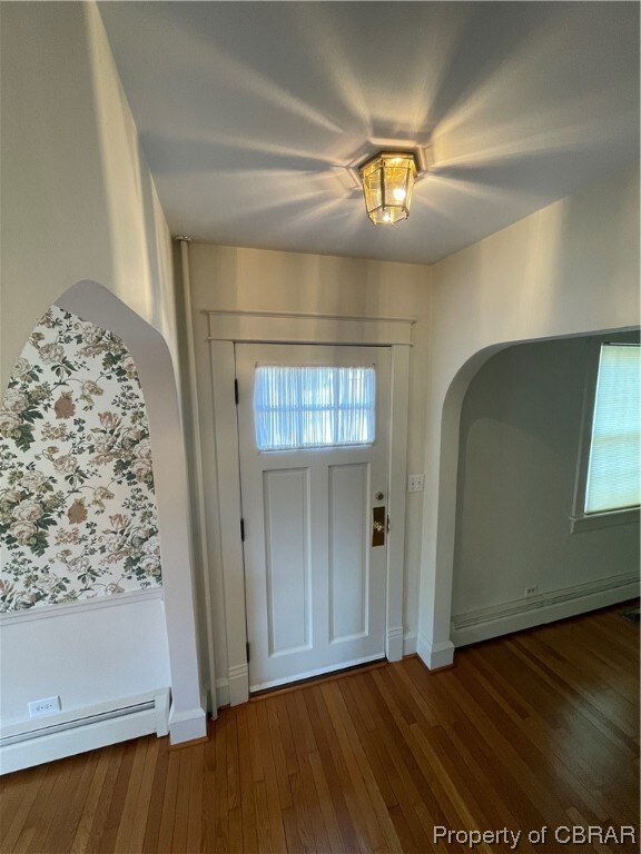 Entrance foyer featuring  wood floors