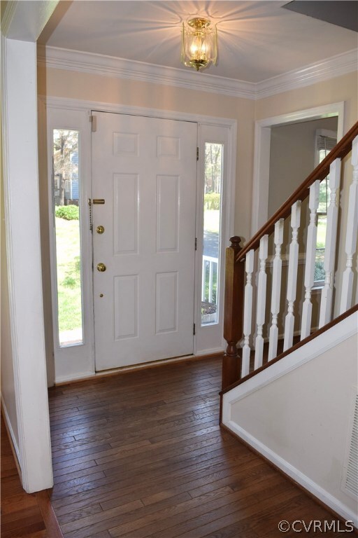 Front Entry with hardwood floors, double member crown molding and fresh paint