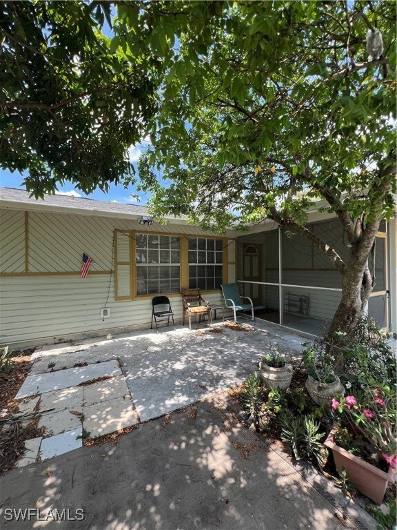 Back of property with a patio