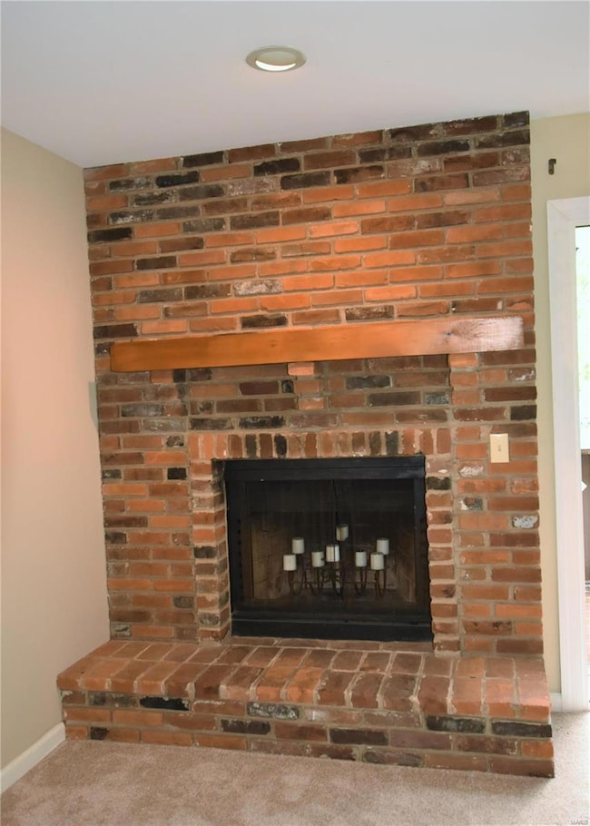 Full brick wood-burning fireplace & hearth has woo