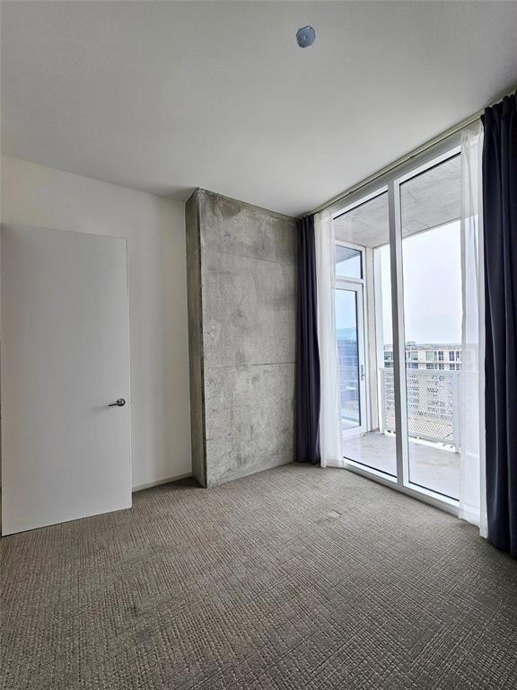 Empty room featuring carpet