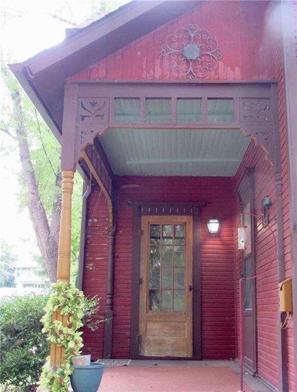 Covered front porch with filagree stencil trim and