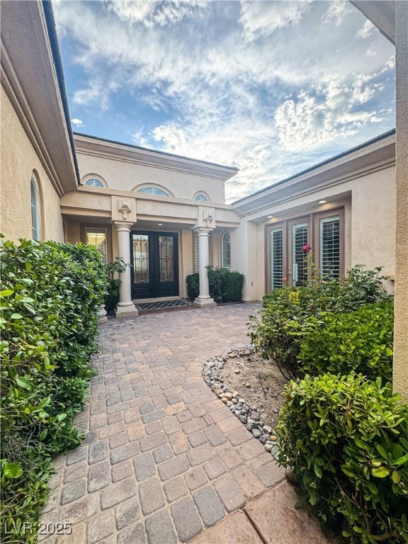Doorway to property featuring french doors and stu