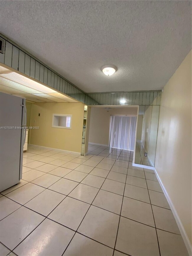Living dining combination entry to kitchen and family room.