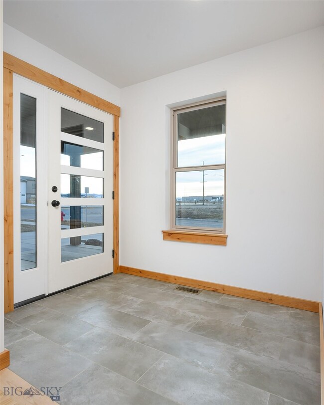 Entryway off covered porch with plenty of light fo