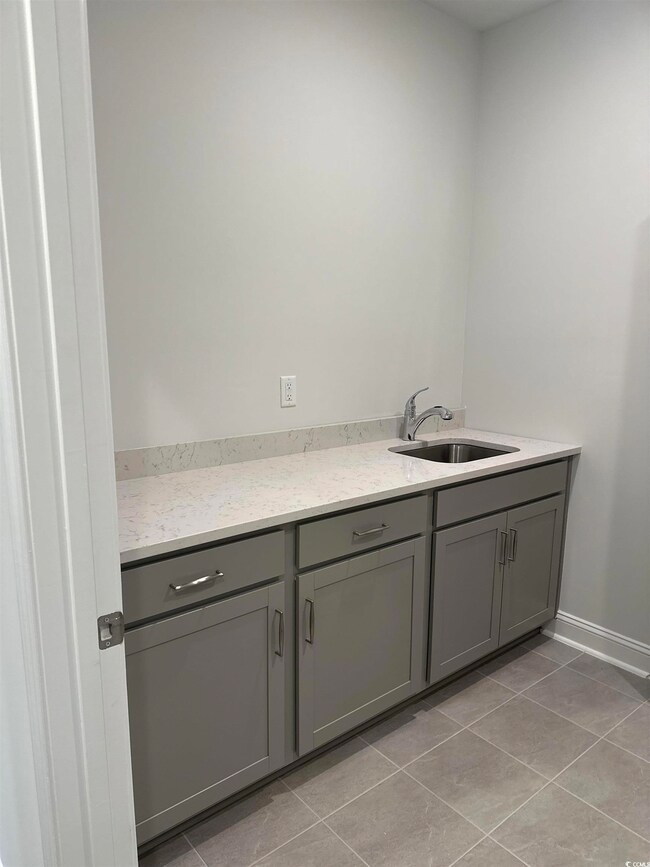 Interior space with light tile patterned flooring 