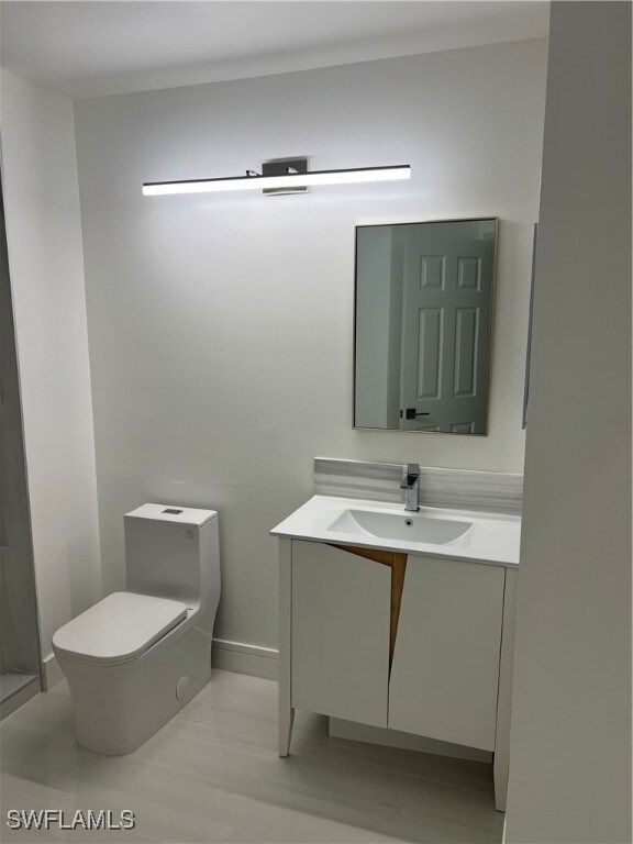 2nd Bathroom with vanity and toilet