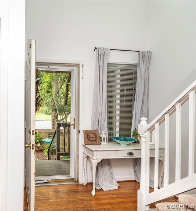 Foyer entrance featuring hardwood flooring