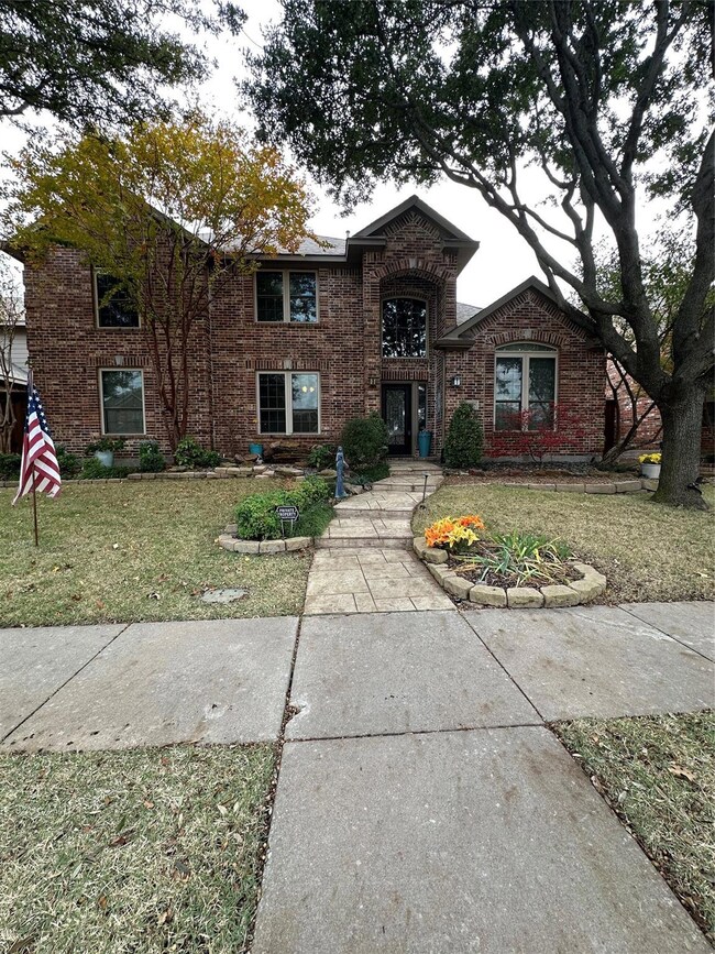 Traditional-style home featuring brick siding and 