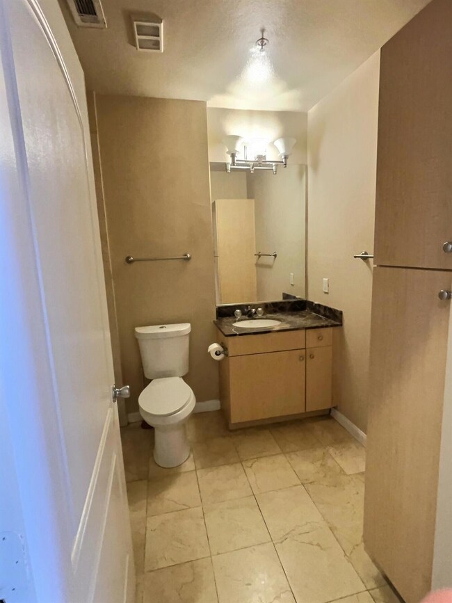 Bathroom with vanity and toilet
