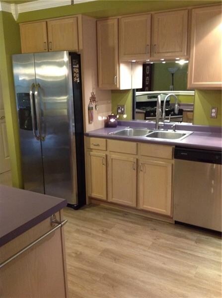Bleached Oak Cabinets with Stainless Steel Applian