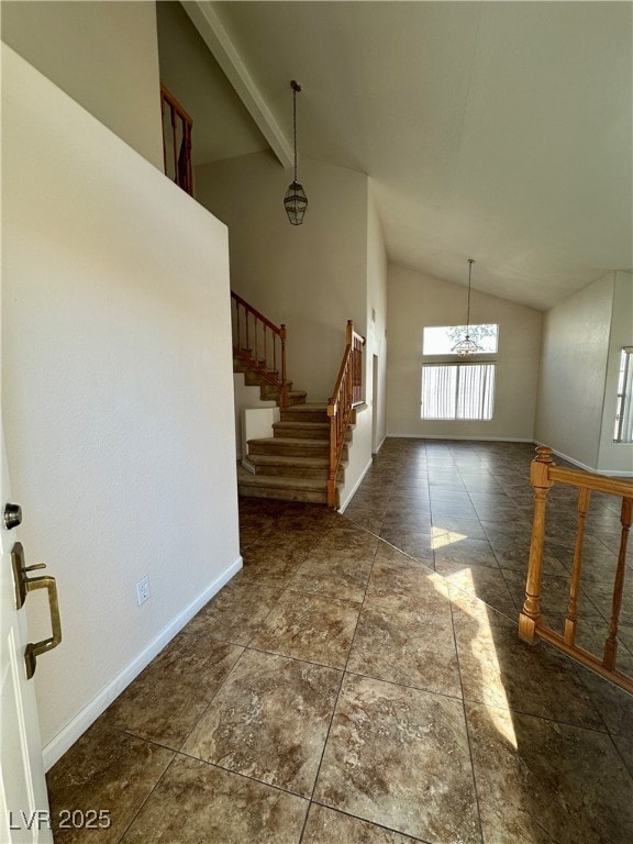 Entrance foyer featuring a chandelier, stairway, a