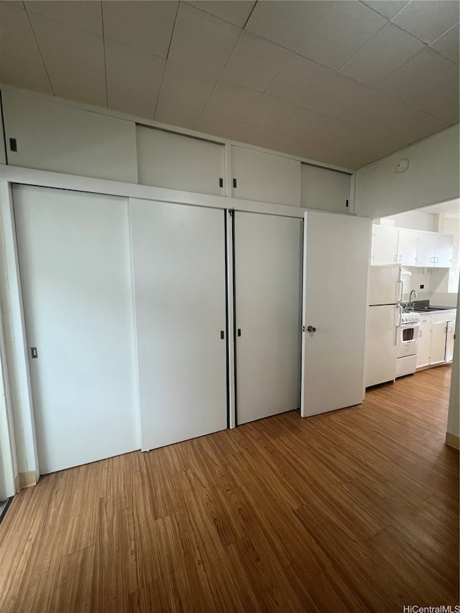 Plenty of closet space with storage above too.