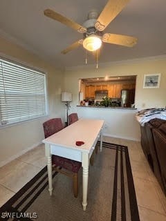 Rec room featuring a ceiling fan and light tile pa