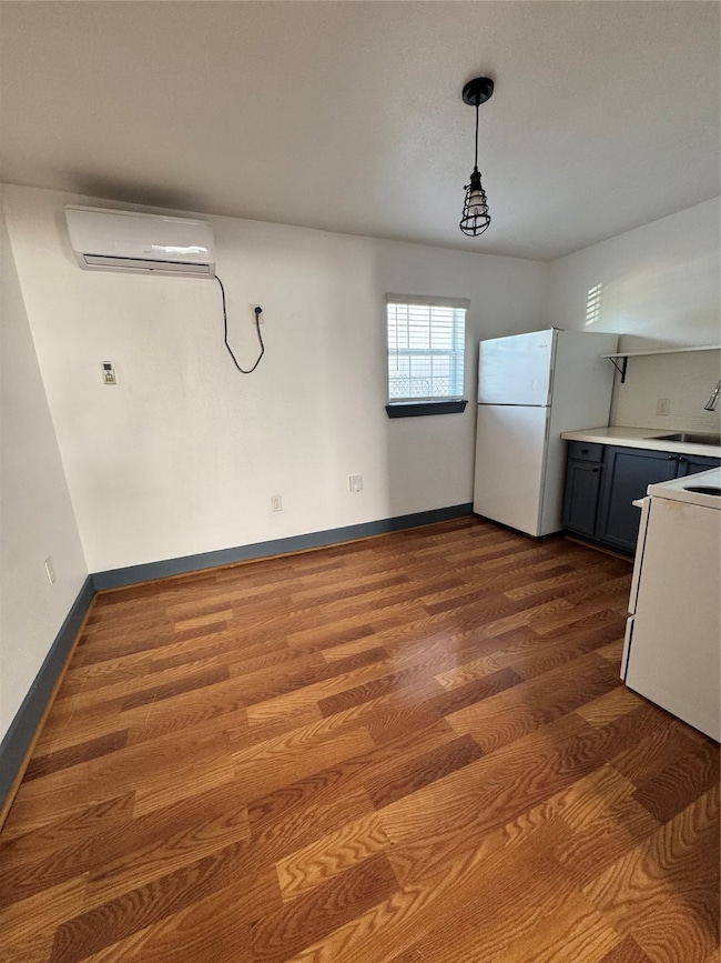 View from living room area, entrance to kitchen an