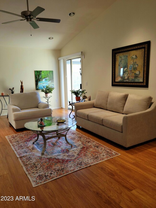 Living Room w/ vaulted ceiling