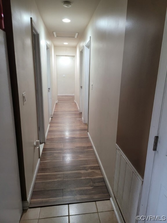 Hallway leading to 3 of the bedrooms and ktchen