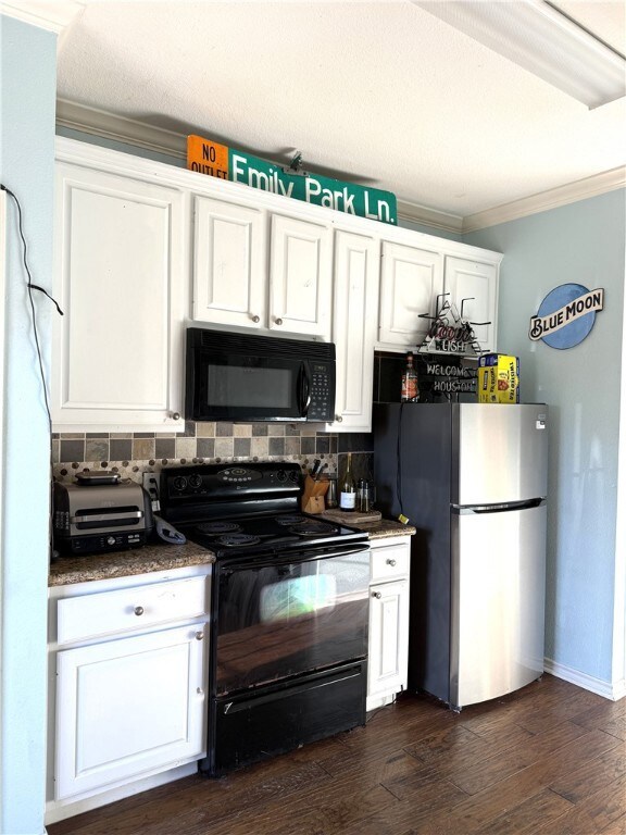 Kitchen featuring white cabinetry, black appliances, decorative backsplash, crown molding, and dark wood-style floors