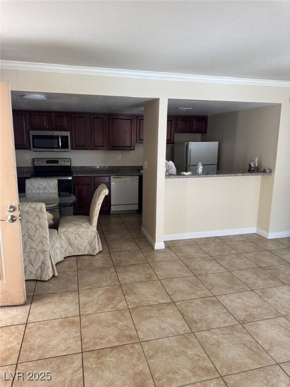 Kitchen featuring appliances with stainless steel