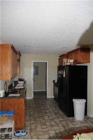 Home features a galley kitchen with all the appliances.