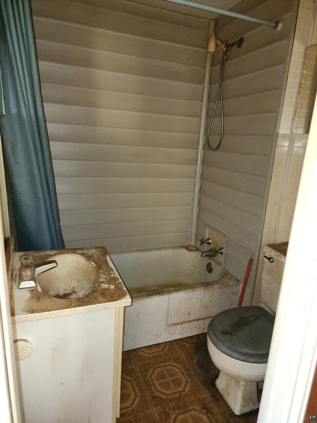 Full bathroom featuring vanity, shower / bath comb