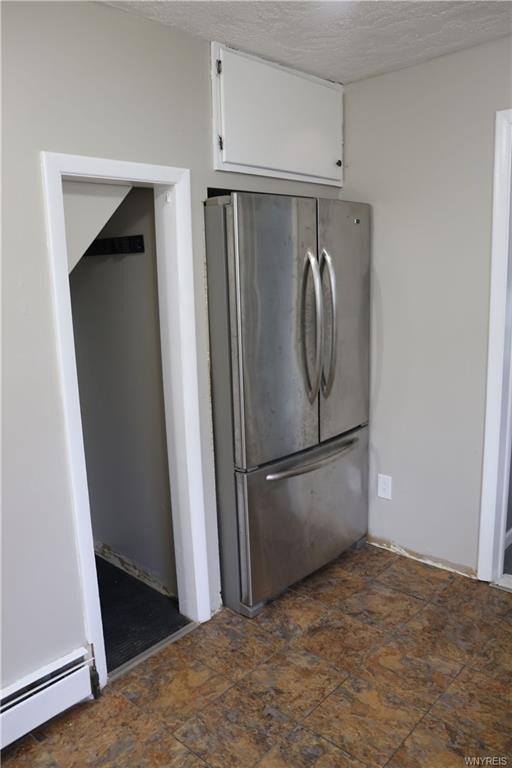 Kitchen, pantry storage to side of refrigerator.