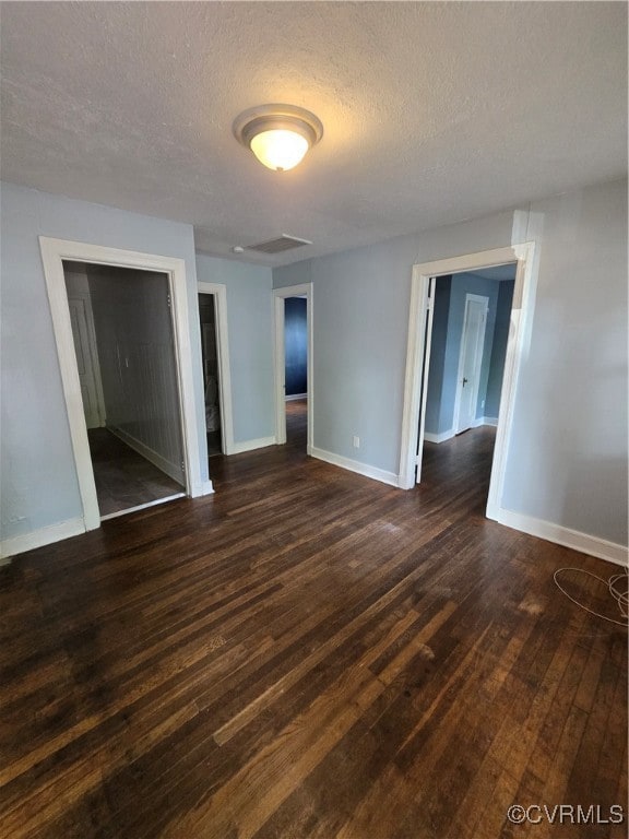 Unfurnished room featuring a textured ceiling and