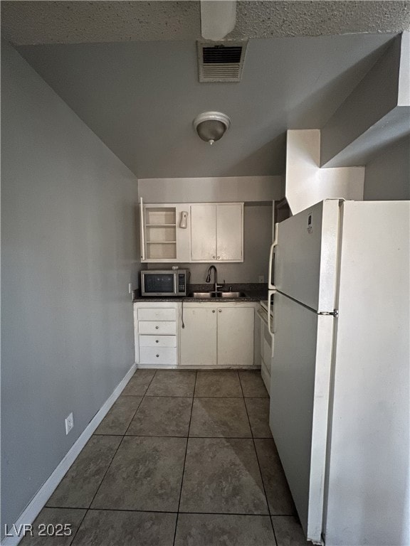 Kitchen featuring visible vents, stainless steel m