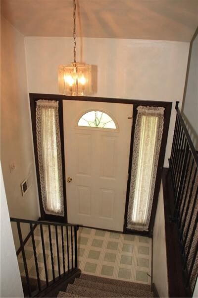 Walk into a Chandelier Entryway with Side Window D
