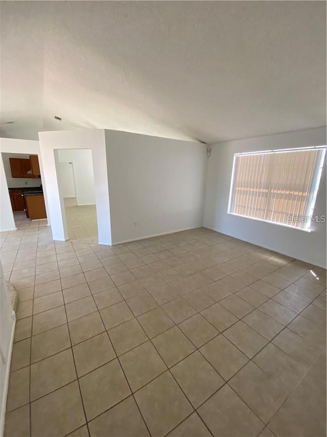 Living room area looking towards the kitchen and bonus room.