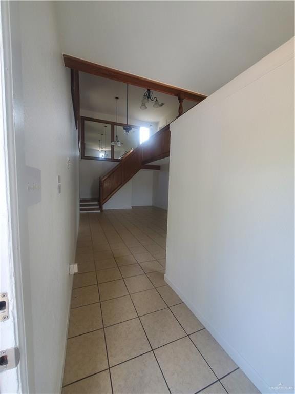 Hall with light tile patterned floors